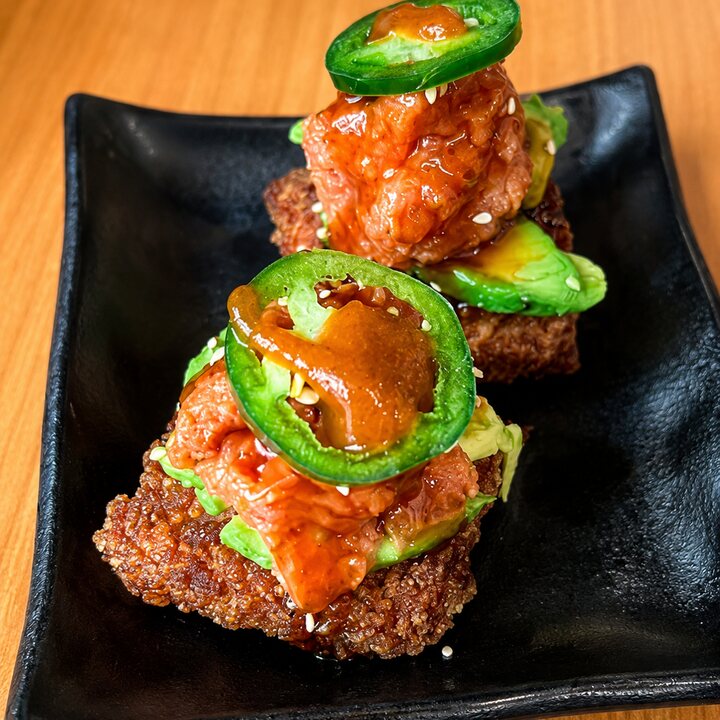 Seared beef over crispy rice with jalapeño