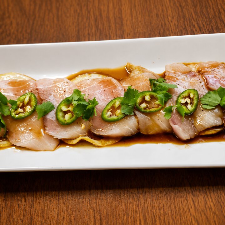 Yellowtail sashimi with serrano and ponzu