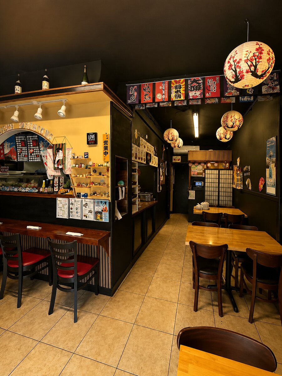 Sushi Yorimichi dining room with paper lanterns and Japanese banners